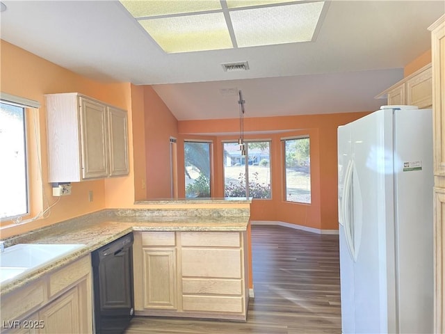 kitchen with visible vents, dishwasher, light countertops, a peninsula, and white fridge with ice dispenser