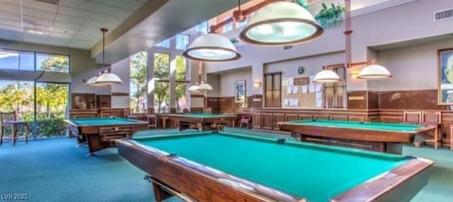 3117 Brightridge Dr, Las Vegas, NV 89134 - playroom featuring pool table, carpet flooring, a wainscoted wall, and a towering ceiling