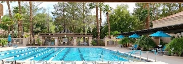3117 Brightridge Dr, Las Vegas, NV 89134 - community pool featuring view of wooded area and a patio