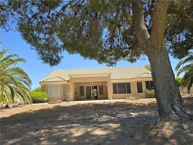 3117 Brightridge Dr, Las Vegas, NV 89134 - rear view of property with a tile roof and stucco siding