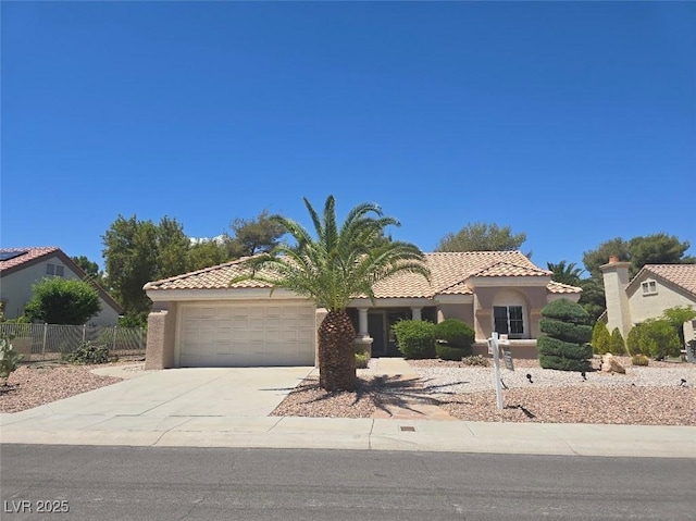 3117 Brightridge Dr, Las Vegas, NV 89134 - mediterranean / spanish-style home with a garage, driveway, stucco siding, and a tiled roof
