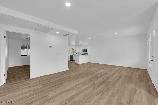 unfurnished living room with recessed lighting, visible vents, baseboards, and light wood-style floors