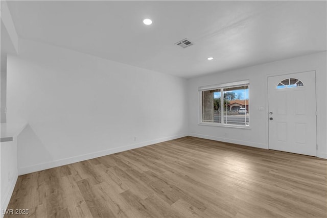 entrance foyer with recessed lighting, wood finished floors, visible vents, and baseboards