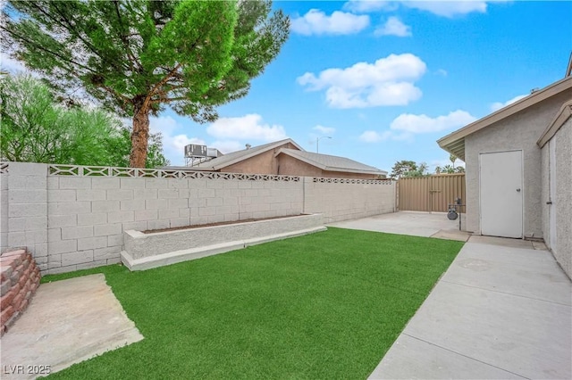 view of yard featuring a patio and a fenced backyard