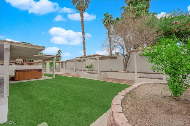 view of yard featuring a patio, a fenced backyard, and a hot tub