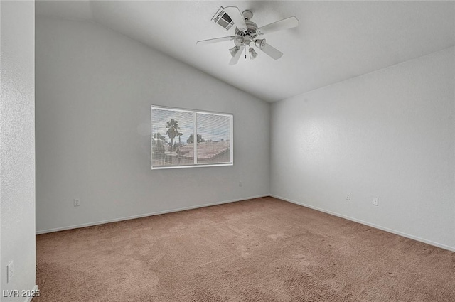 carpeted spare room featuring lofted ceiling, a ceiling fan, visible vents, and baseboards