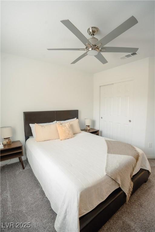 bedroom featuring visible vents, ceiling fan, and carpet flooring