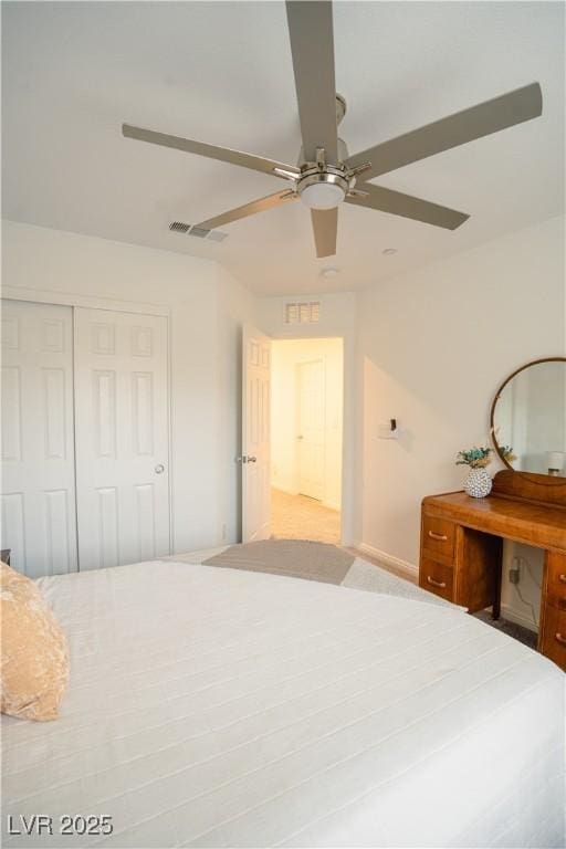 unfurnished bedroom featuring visible vents, a closet, and ceiling fan