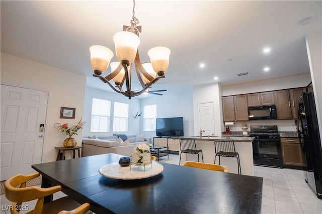 dining room featuring light tile patterned floors, recessed lighting, visible vents, and a chandelier