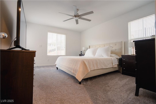 carpeted bedroom with baseboards and ceiling fan