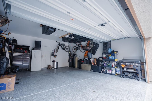 garage featuring a garage door opener