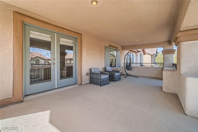 view of patio featuring a balcony