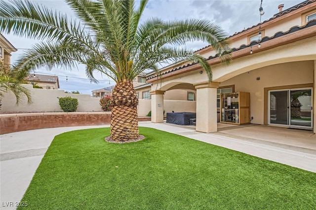 view of yard featuring a patio and fence