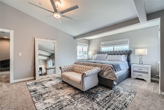 carpeted bedroom featuring vaulted ceiling, a ceiling fan, and baseboards