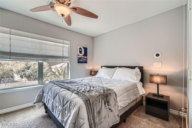 bedroom featuring a ceiling fan, baseboards, and carpet floors