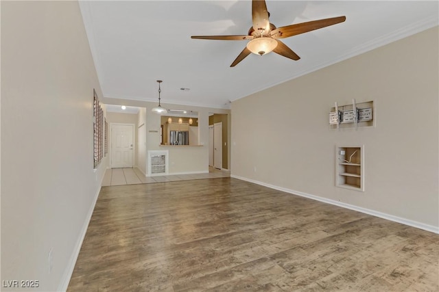 unfurnished living room featuring crown molding, baseboards, ceiling fan, built in features, and wood finished floors