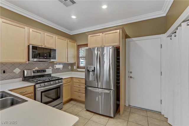 kitchen with visible vents, ornamental molding, light brown cabinets, tasteful backsplash, and appliances with stainless steel finishes