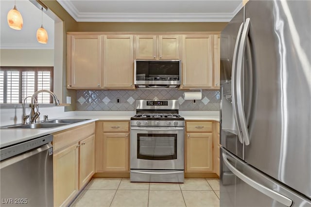 kitchen featuring light brown cabinetry, a sink, appliances with stainless steel finishes, crown molding, and light countertops