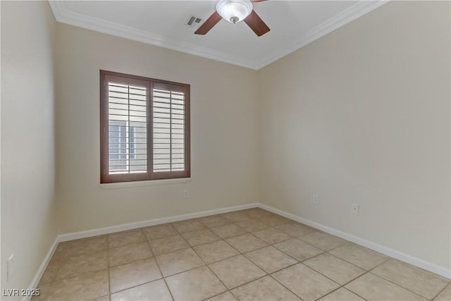 empty room with crown molding, a ceiling fan, visible vents, and baseboards