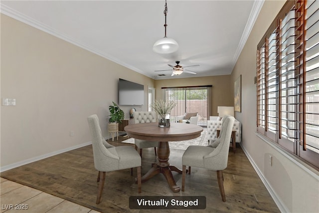 dining room featuring wood finished floors, ornamental molding, and a ceiling fan