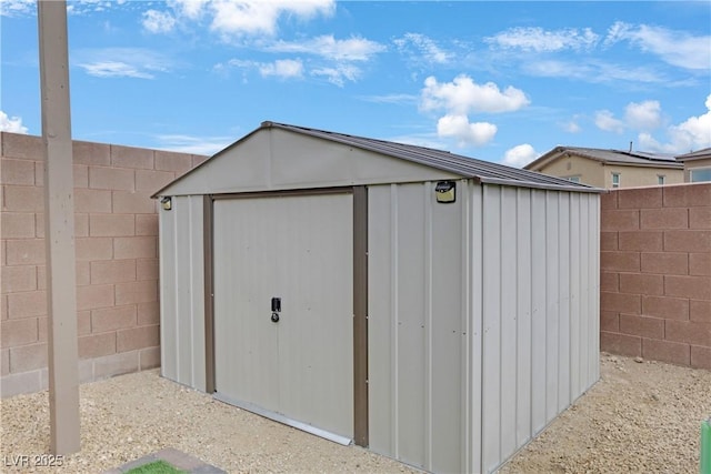 view of shed featuring a fenced backyard