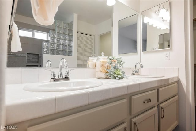 bathroom with double vanity and a sink