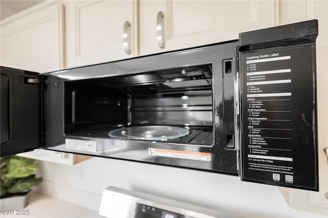 interior details featuring white cabinetry