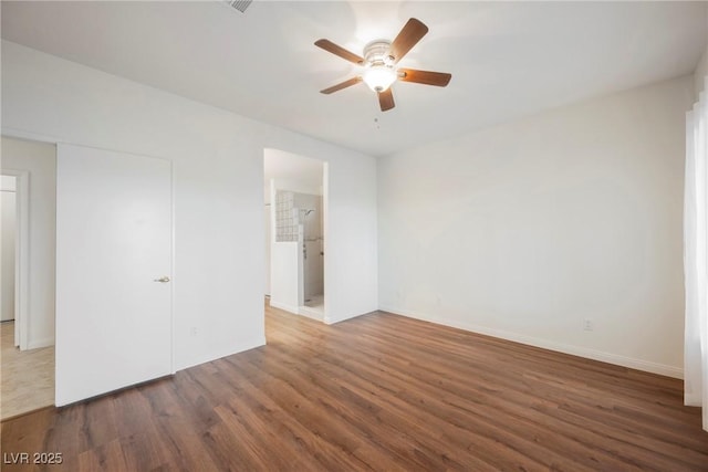 unfurnished bedroom featuring wood finished floors, baseboards, and ceiling fan