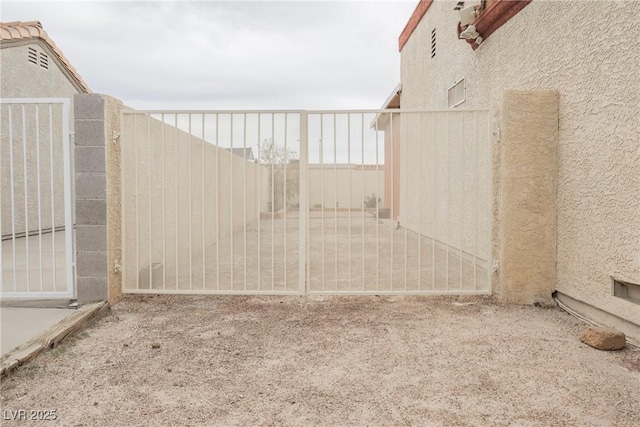 view of yard featuring fence and a gate