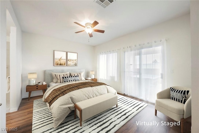 bedroom featuring access to exterior, visible vents, a ceiling fan, and wood finished floors