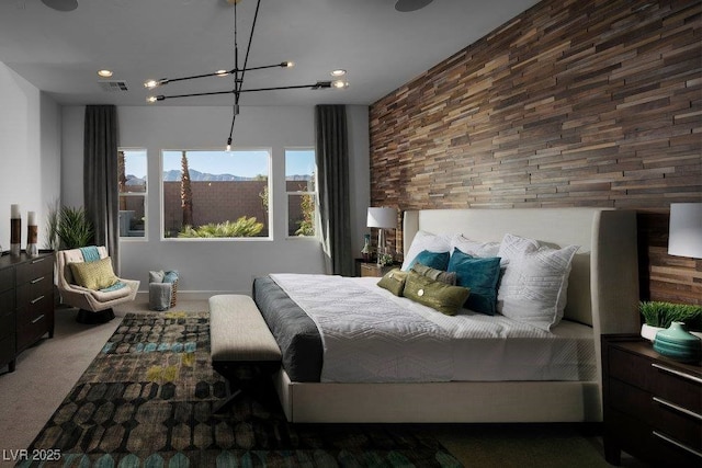 bedroom featuring an inviting chandelier, carpet, and visible vents