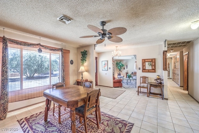 10615 Rancho Destino Rd, Las Vegas, NV 89183 - dining area with light tile patterned floors, ceiling fan with notable chandelier, visible vents, and a textured ceiling
