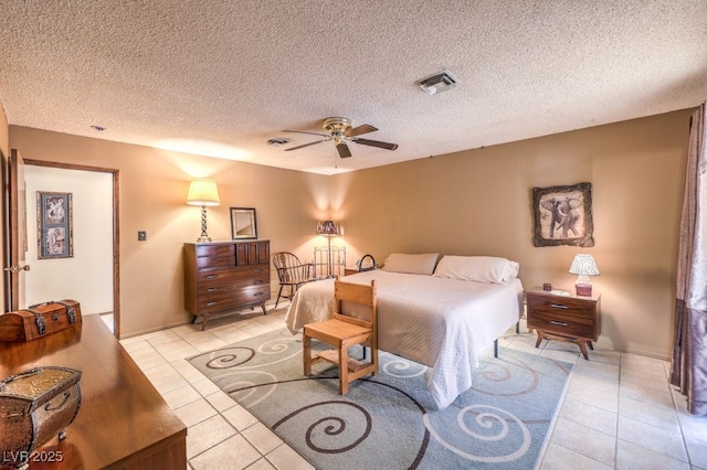 10615 Rancho Destino Rd, Las Vegas, NV 89183 - bedroom featuring ceiling fan, light tile patterned flooring, visible vents, and a textured ceiling