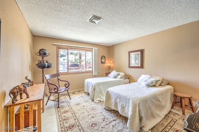 10615 Rancho Destino Rd, Las Vegas, NV 89183 - bedroom featuring baseboards, visible vents, and a textured ceiling