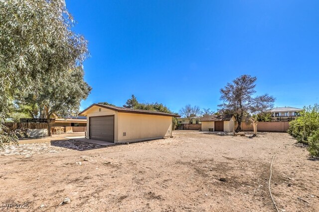 10615 Rancho Destino Rd, Las Vegas, NV 89183 - exterior space with an outdoor structure, fence, and a garage