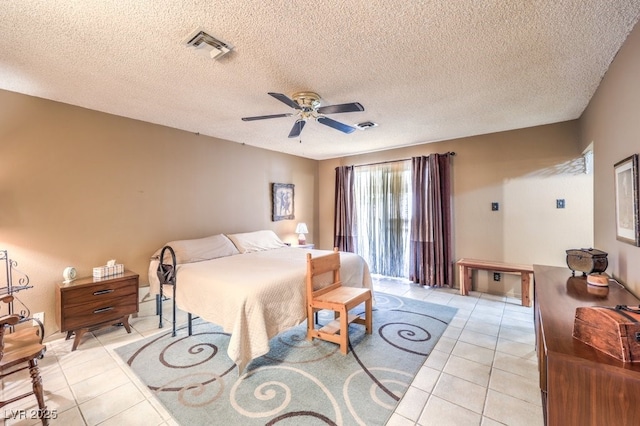 10615 Rancho Destino Rd, Las Vegas, NV 89183 - bedroom featuring light tile patterned floors, visible vents, a textured ceiling, and ceiling fan