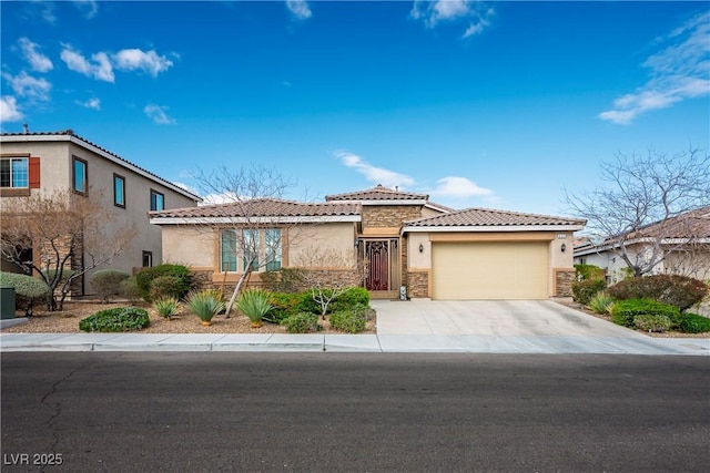 view of front facade with stucco siding, an attached garage, and concrete driveway