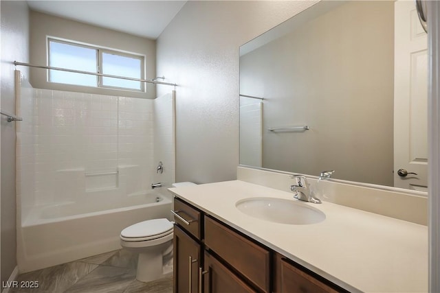 bathroom featuring vanity, toilet, and washtub / shower combination