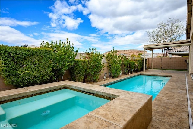 view of swimming pool featuring a fenced backyard and a fenced in pool