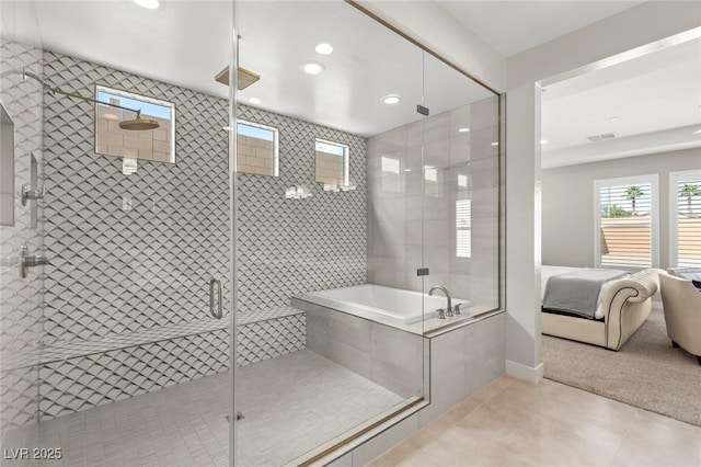 full bathroom with tiled bath, visible vents, a stall shower, and ensuite bathroom