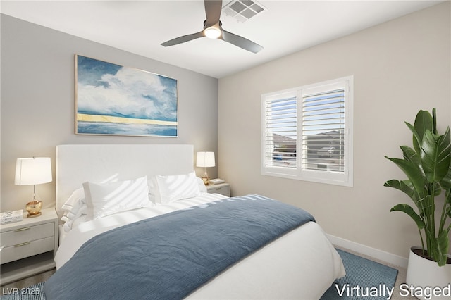 carpeted bedroom with visible vents, ceiling fan, and baseboards