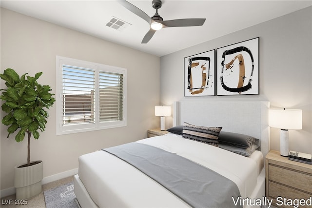 carpeted bedroom featuring a ceiling fan, baseboards, and visible vents