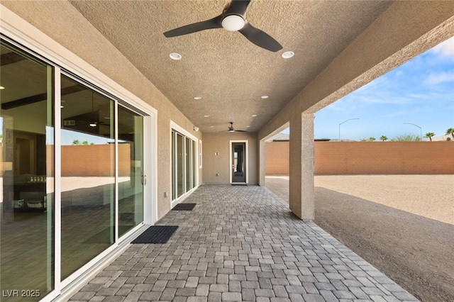 view of patio featuring a fenced backyard and ceiling fan