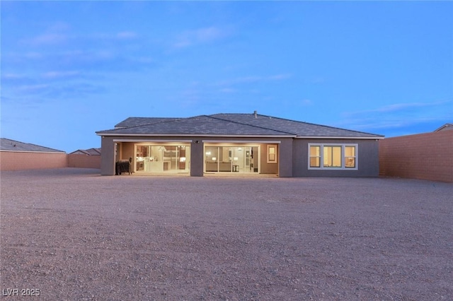 back of house featuring stucco siding