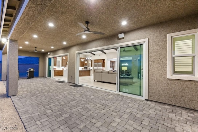 view of patio / terrace featuring ceiling fan