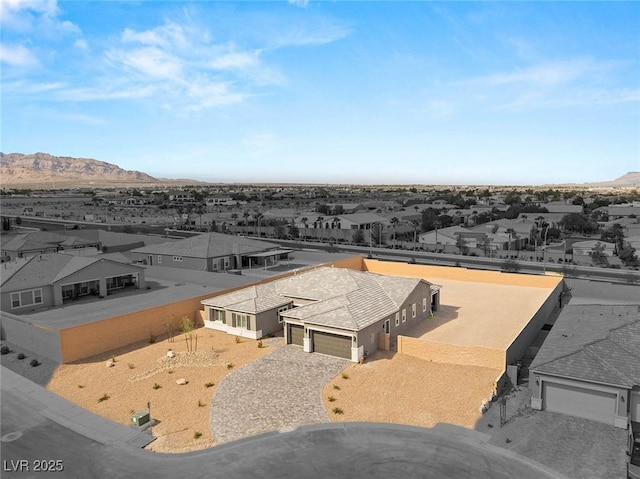 aerial view featuring a mountain view and a residential view