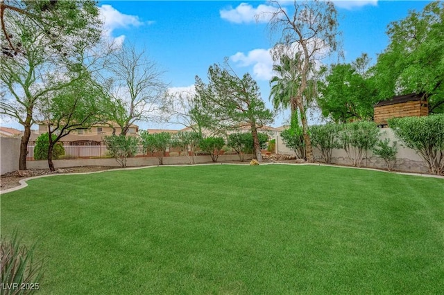 view of yard with a fenced backyard