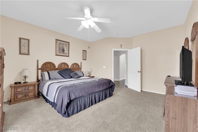 carpeted bedroom featuring a ceiling fan and vaulted ceiling