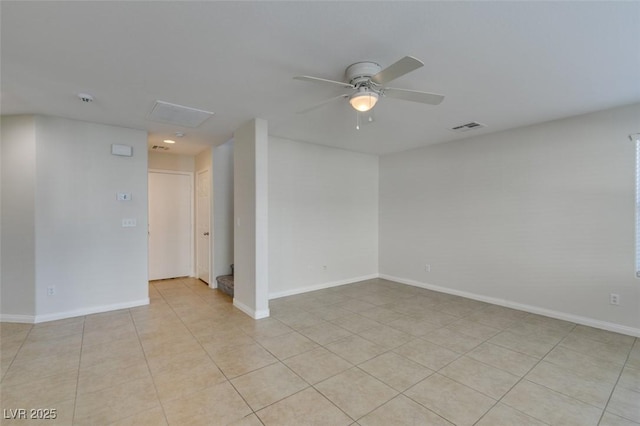 spare room with light tile patterned floors, baseboards, visible vents, and ceiling fan