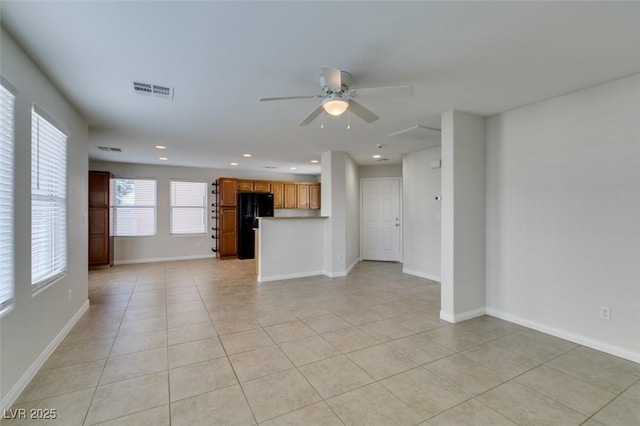 unfurnished living room featuring recessed lighting, baseboards, and a ceiling fan